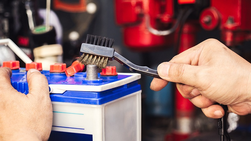 Clean the terminals  of car battery with a wire brush